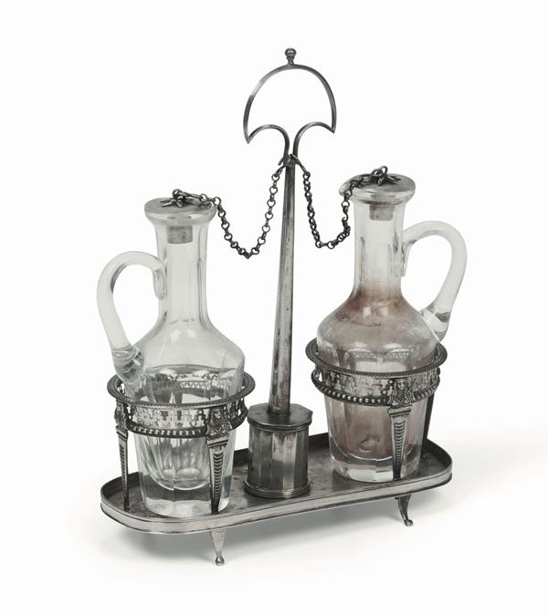 Oliera in argento fuso, sbalzato, traforato e cesellato. Ampolle in vetro molato. Genova marchio della Torretta per l’anno 1819