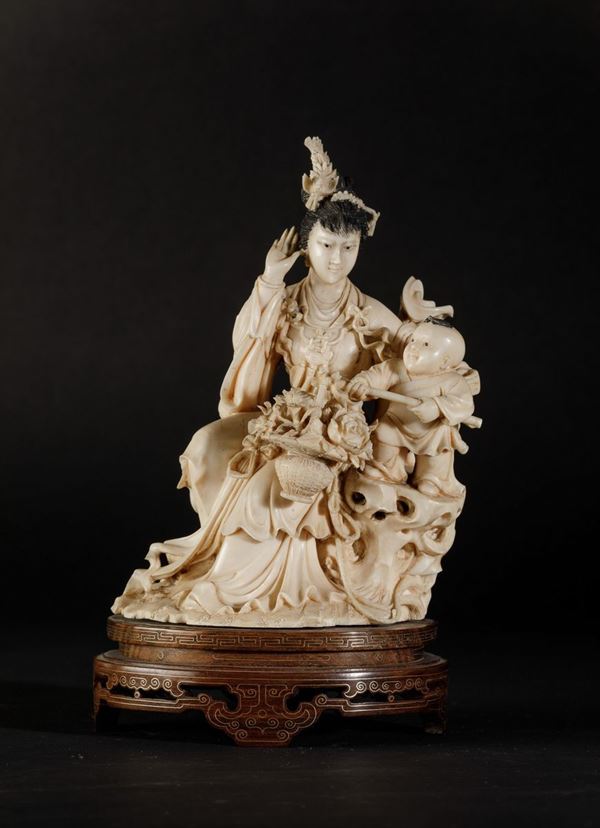 A carved ivory group, China, early 1900s