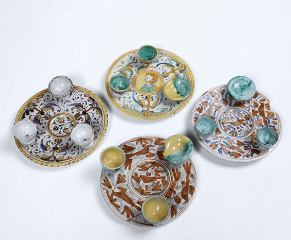 Quattro piatti portauovo Deruta, XVII secolo