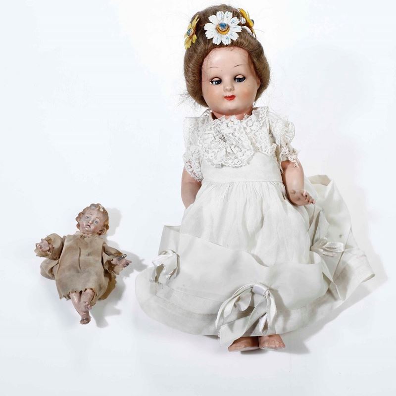 Bambinello da presepe in legno dipinto e bambola  - Asta Antiquariato | Cambi Time - Cambi Casa d'Aste