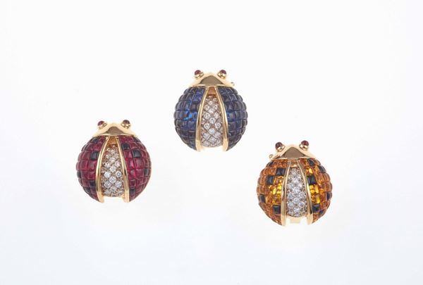 Three ruby, sapphire, yellow sapphire, onix and diamond earrings