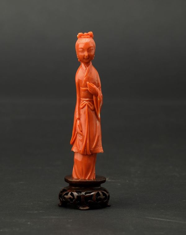 A carved coral figure, China, early 1900s