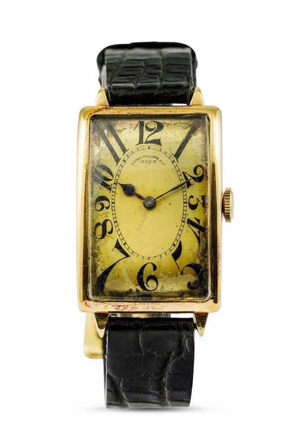 PATEK PHILIPPE - Raro orologio d'oro giallo 18k di forma rettangolare cassa Curvex anni '20 carica manuale. Con scatola