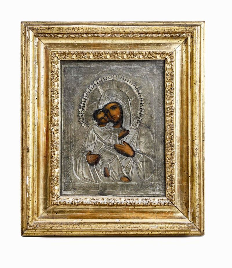 Vergine di Vladimir Icona su tavola con riza in metallo e cornice in legno intagliato e dorato. (non pertinente) Scuola russa, XIX secolo La Vergine di Vladimir  - Asta Argenti da Collezione - I - Cambi Casa d'Aste