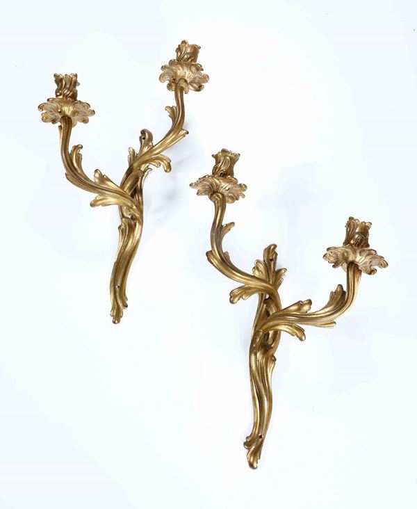 Coppia di appliques in bronzo dorato a due luci