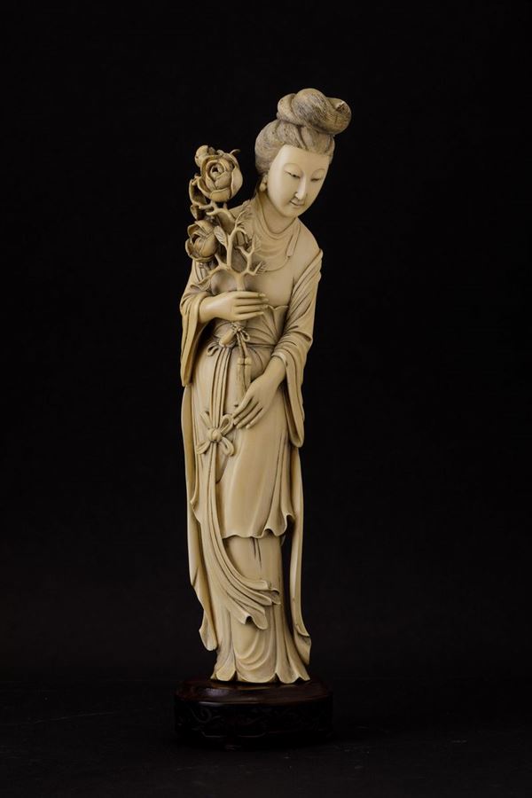 A carved ivory figure, China, early 1900s