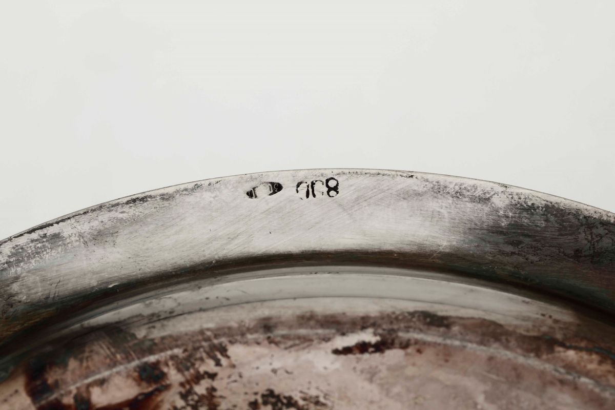 Insieme di Dodici Sottobicchieri e un Sottobottiglia in Argento. Argenteria Veneta del XX Secolo....