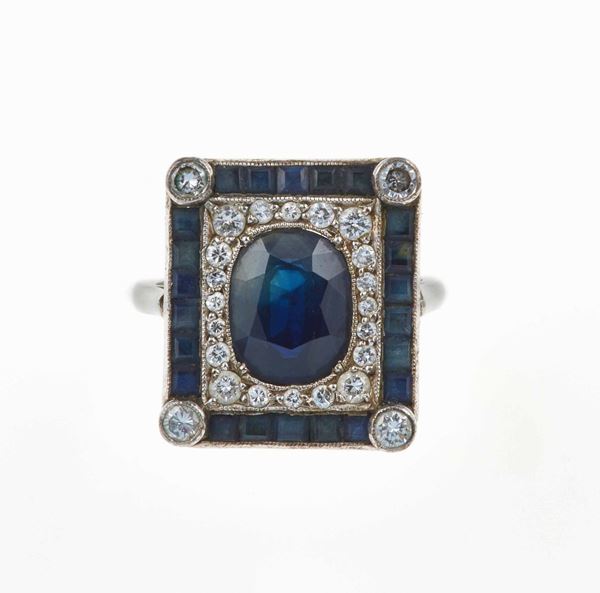 Sapphire and diamond ring and a pair of earrings
