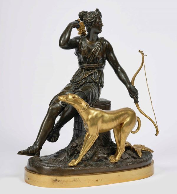 Diana Cacciatrice seduta con levriero in bronzo dorato e patinato. Francia XIX secolo