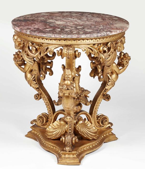 Tavolo da centro in legno intagliato e dorato. Toscana seconda metà del XIX secolo