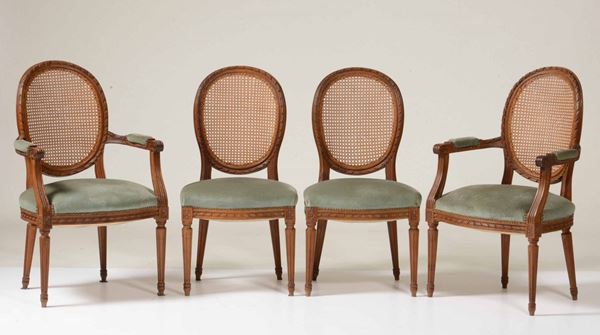 Gruppo di dieci sedie e due poltrone in stile Luigi XVI