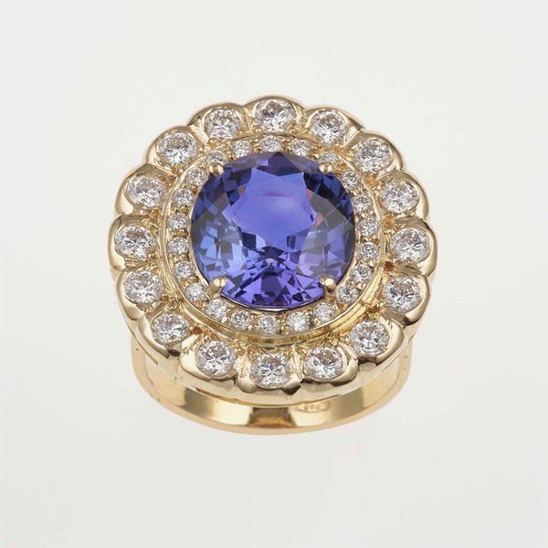 Tanzanite and diamond cluster ring; accompanied by a gemological report