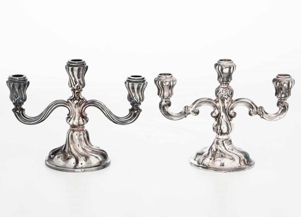 Due candelabri in argento a tre fiamme. Argenteria artistica italiana del XX secolo