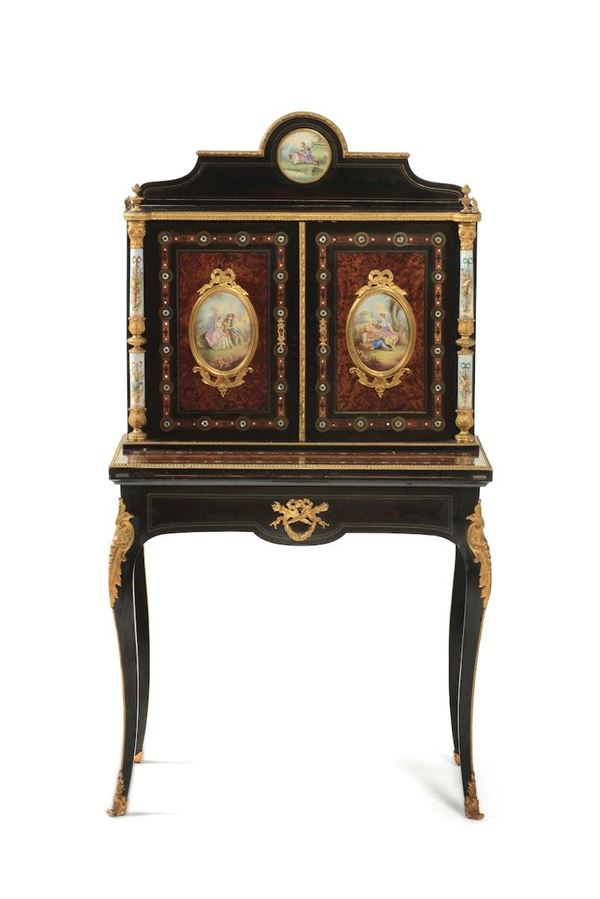 Mobile in stile Napoleone III in legno lastronato, ebanizzato con applicazioni di porcellane di Sèvres e bronzi cesellati e dorati. XIX-XX secolo