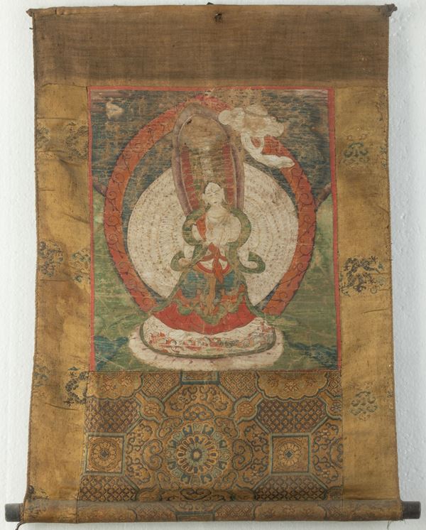 Thangka su seta raffigurante divinità centrale entro aura, Tibet, XIX secolo