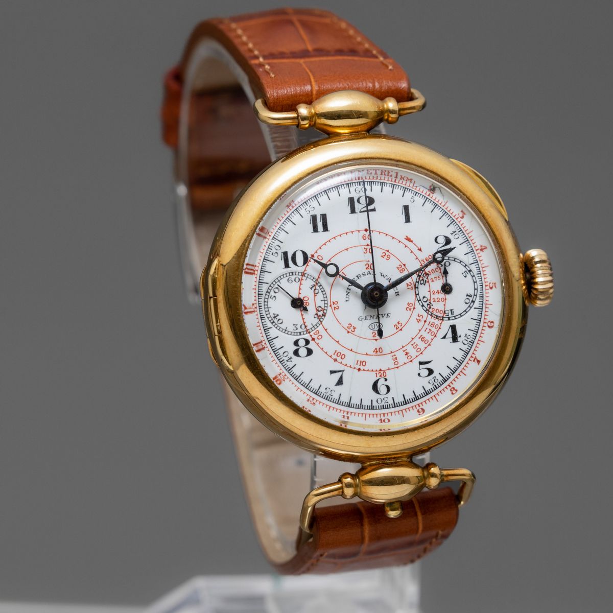 Universal Watch - Cronografo Monopulsante di Importanza Storica in Oro 18k con Anse Snodate, Quad...