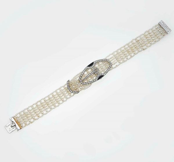 Seed pearl, diamond, enamel and platinum bracelet. Signed and numbered Cartier 3220