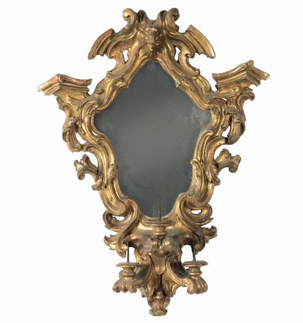 Specchiera in legno intagliato e dorato. Fine XVIII secolo