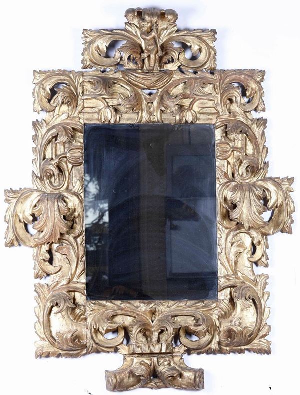 Specchiera in legno scolpito e dorato. XIX secolo