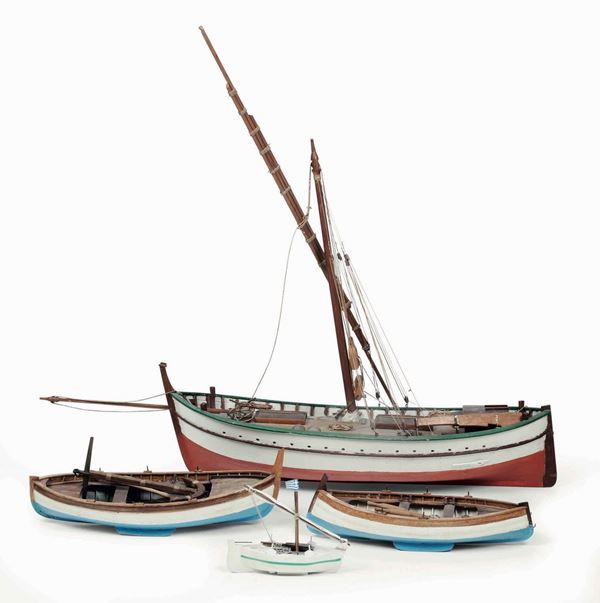 Barca da pesca e tre modellini di gozzo in legno. XX secolo