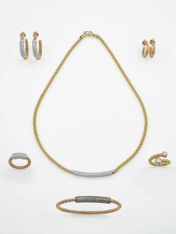 Group of two pairs of earrings, two rings, one necklace and a bangle bracelet
