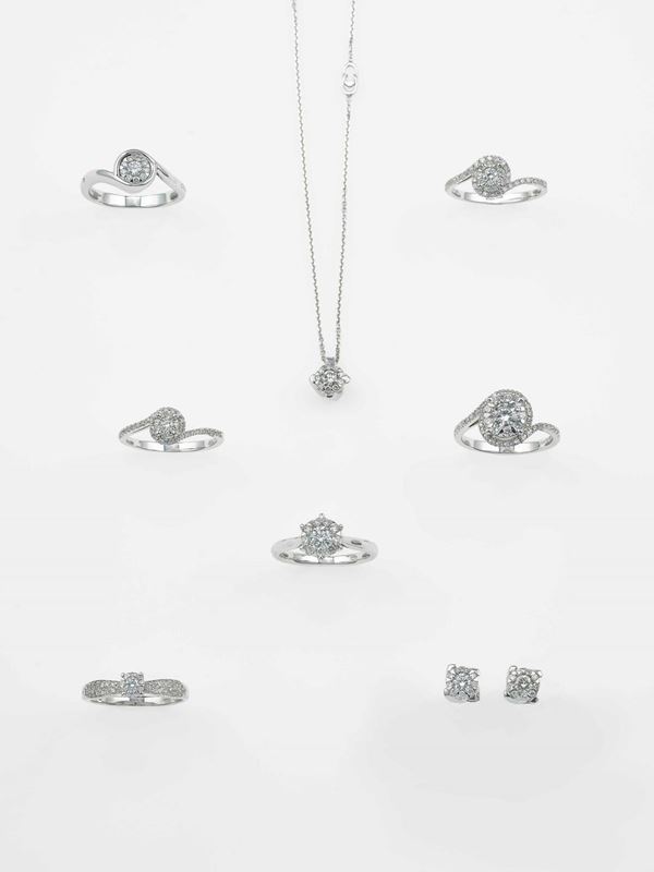 Group of ten diamond rings, two pendents and a pair of earrings