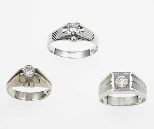 Two brilliant-cut diamond rings and one synthetic stone ring