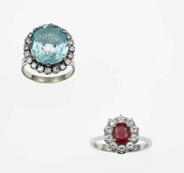 One aquamarine and diamond ring and one ruby and diamond ring