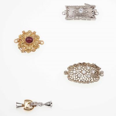 Lotto Composto da Quattro Fermezze con Piccoli Diamanti e Rubino Taglio Cabochon