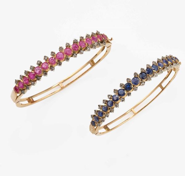 Two ruby and sapphire gold bangles