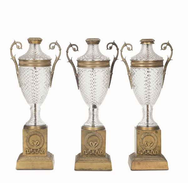 Tre vasi in cristallo e metallo dorato. XIX-XX secolo