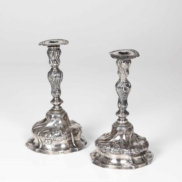 Due candelieri. Argento fuso, sbalzato e cesellato. Genova, XVIII secolo (?)