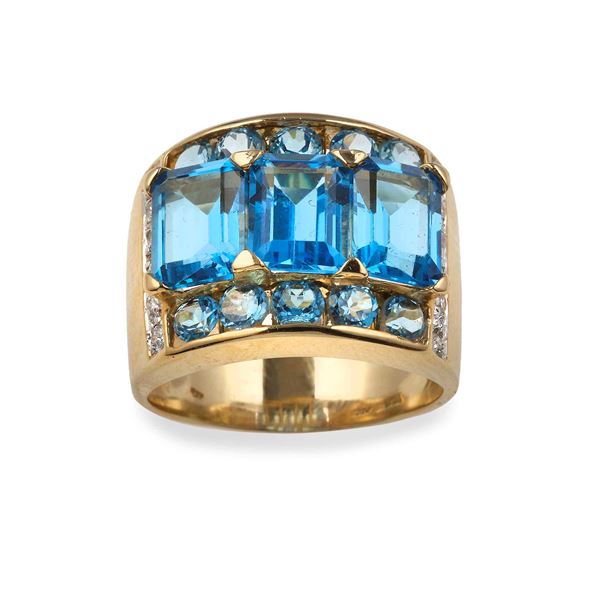 Anello con topazi azzurri e piccoli diamanti