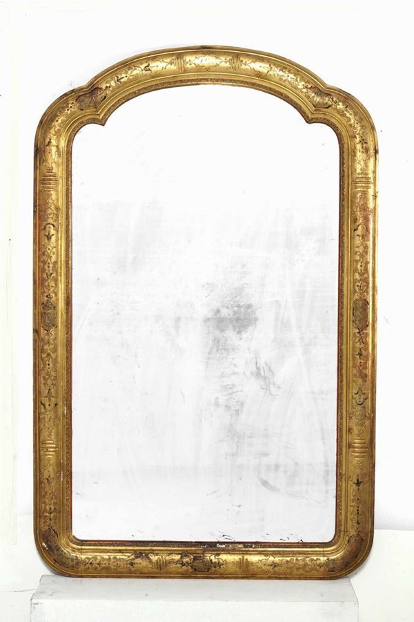 Specchiera polilobata in legno dorato. XIX secolo