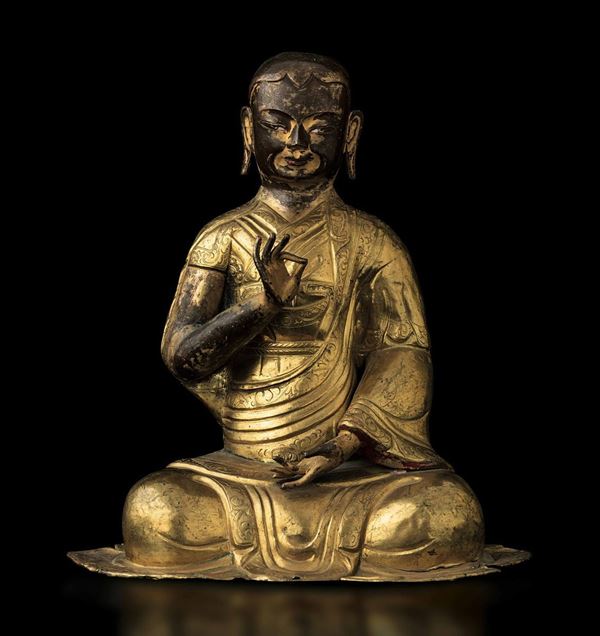 Figura di monaco in rame parzialmente dorato con tracce di policromia, Tibet, XVIII secolo