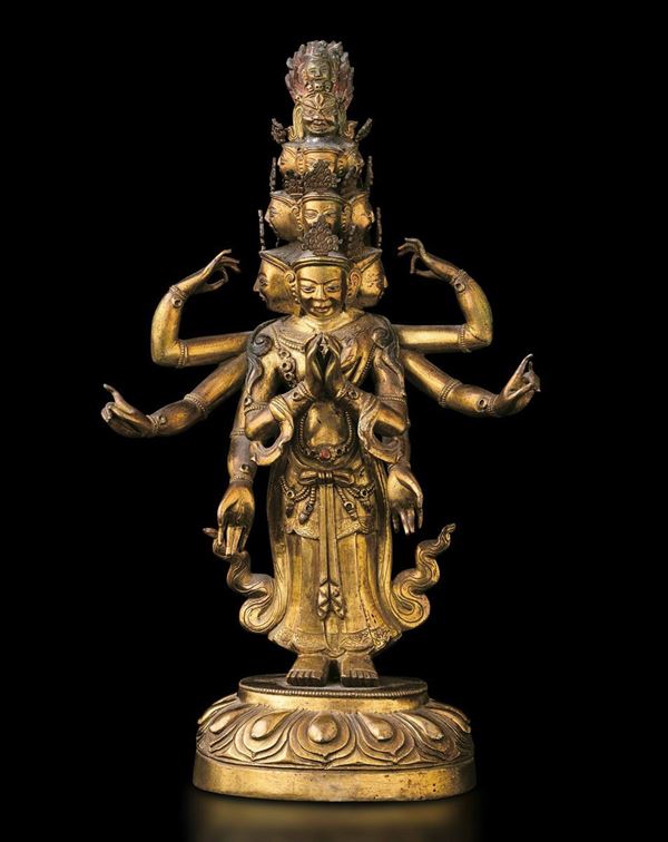 Figura di Ekadasamukha-Avalokitesvara eretto su fiore di loto in bronzo dorato con tracce di policromia e innesti di pietre dure, Tibet, XVIII secolo