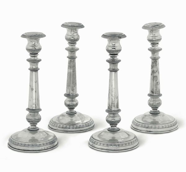 Quattro candelieri. Argento fuso e sagomato. Italia XIX-XX secolo