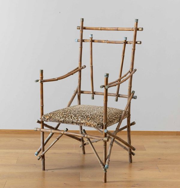 Giovanni Patrini - Poltrona in bambù con puntali in ottone e seduta in tessuto animalier. 1970 ca