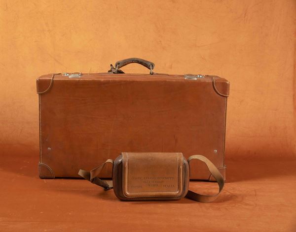 A suede suitcase and a waistbag