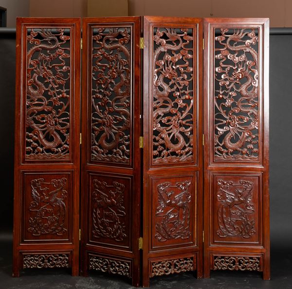 A carved wood four-fold screen, China