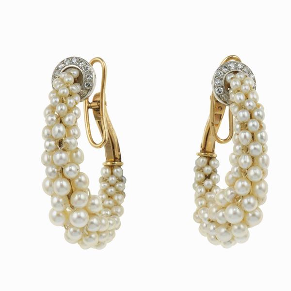 Pair of seed pearls, diamond, gold and platinum earrings. Signed Cartier, Paris and numbered 0548