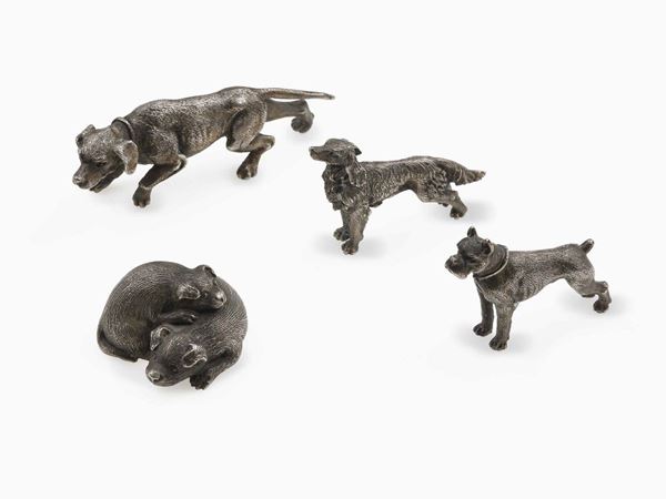 Four silver dogs. Signed M. Buccellati