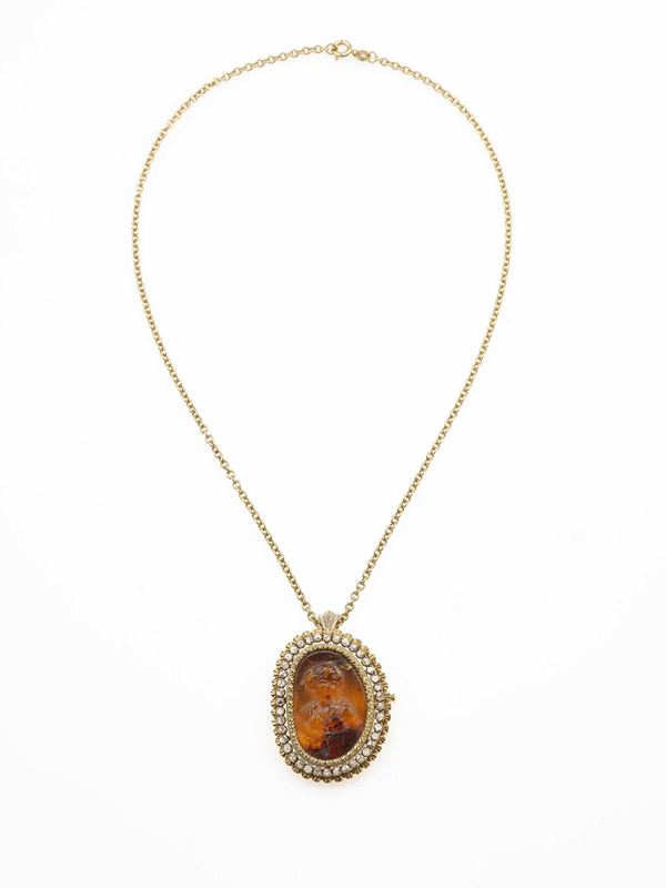 necklace with cameo on amber and diamond pendant