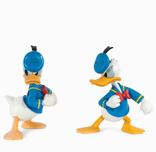 Disney: two angry Donald Duck statuettes