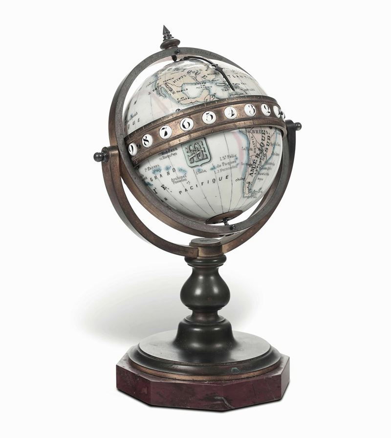 Orologio in porcellana e bronzo dorato in forma di globo.Paul Buhre, Russia, XIX secolo  - Asta Dimore Italiane - Cambi Casa d'Aste
