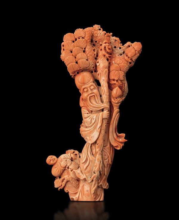 A carved coral group, China, early 1900s