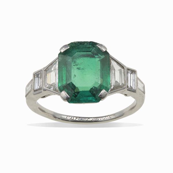 Emerald, diamond and platinum ring. Signed Cartier, London