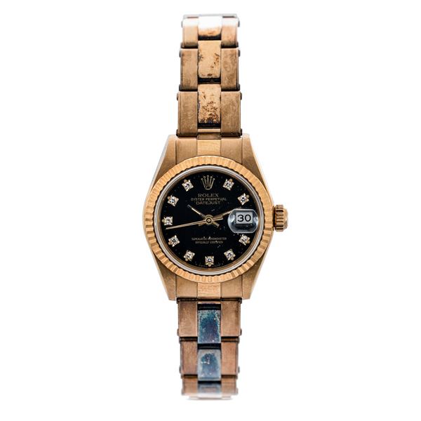 Rolex - Datejust 69178 lady yellow gold, black dial with diamond hour markers, riveted Oyster bracelet with oxidation, which, together with the sticker on the case back, shows that the watch has been scarsely worn
