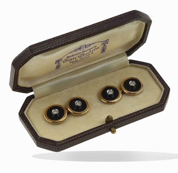Pair of enamel and diamond cufflinks. Fitted case