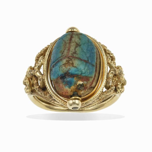 Carved hardstone and gold ring